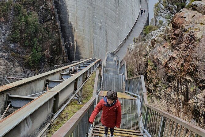 From Hobart: Gordon Dam and Lake Pedder Wilderness Day Tour - Gordon Dam at human scale: the 140m arch walk