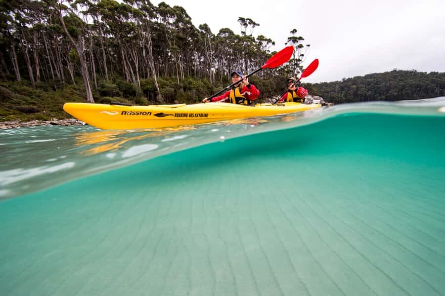 Tasman Peninsula Full-Day Sea Kayak Excursion - Launching into Fortescue Bay and paddling beneath 200-meter cliffs